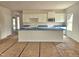 A newly constructed kitchen features white cabinets, an island, and modern stainless-steel appliances at 21 Mildred Pl, Broadway, NC 27505