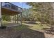 Exterior view of deck overlooking backyard with pond and beautiful natural surroundings at 219 Arbordale Ct, Cary, NC 27518