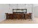 Entertain in this amazing bar area with granite counters, custom bar, and beautiful lighting at 219 Arbordale Ct, Cary, NC 27518
