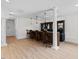 Basement bar area with bar seating, a bar and recessed lighting at 219 Arbordale Ct, Cary, NC 27518