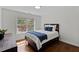 Bedroom featuring natural light and hardwood flooring at 219 Arbordale Ct, Cary, NC 27518