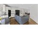 Modern kitchen with an island, featuring granite countertops, stainless steel appliances and lots of cabinet space at 219 Arbordale Ct, Cary, NC 27518