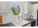Stylish kitchen sink with a unique window view, enhancing the cooking experience with natural light at 219 Arbordale Ct, Cary, NC 27518