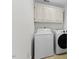 Laundry room with washer, dryer, and cabinets at 219 Arbordale Ct, Cary, NC 27518