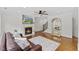 Cozy living room with fireplace, hardwood floors, and a comfortable seating area, perfect for relaxing at 219 Arbordale Ct, Cary, NC 27518