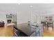 Open-concept living area with a kitchen island, a fireplace, and hardwood flooring, perfect for modern living at 219 Arbordale Ct, Cary, NC 27518