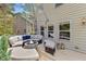 Relaxing patio with comfortable furniture, a fire pit, and stylish decor at 219 Arbordale Ct, Cary, NC 27518