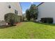 Landscaped side yard between houses, featuring lush lawn and tasteful plantings at 219 Arbordale Ct, Cary, NC 27518