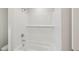 Bright bathroom with a tub shower featuring white subway tile surround at 2202 Cherry Creek Rd, Haw River, NC 27258