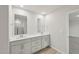 Bathroom features dual sinks, a white quartz counter, and shaker cabinets at 2202 Cherry Creek Rd, Haw River, NC 27258