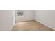 Bedroom features wood floors, neutral paint, recessed lights, and a window to let in natural light at 2202 Cherry Creek Rd, Haw River, NC 27258