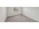 Bedroom features neutral walls and carpet, a window, and ample natural light at 2202 Cherry Creek Rd, Haw River, NC 27258
