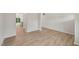 Spacious living room with wood-look floors, and an open floor plan to the kitchen at 2202 Cherry Creek Rd, Haw River, NC 27258