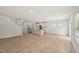 Open concept living room, kitchen, and dining room, featuring wood floors and recessed lights at 2202 Cherry Creek Rd, Haw River, NC 27258