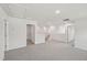 Spacious loft area with neutral walls and carpeting offers flexible living space at 2202 Cherry Creek Rd, Haw River, NC 27258