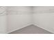 Walk-in closet featuring neutral walls and carpet, providing ample storage space at 2202 Cherry Creek Rd, Haw River, NC 27258