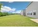 The expansive backyard features green lawn and tree line beyond at 2206 Cherry Creek Rd, Haw River, NC 27258