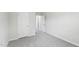 Neutral bedroom features two paneled doors and light gray carpet at 2206 Cherry Creek Rd, Haw River, NC 27258