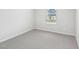 Cozy carpeted bedroom with neutral walls and natural light from a window at 2206 Cherry Creek Rd, Haw River, NC 27258