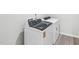 Modern laundry room equipped with new, white appliances at 2206 Cherry Creek Rd, Haw River, NC 27258