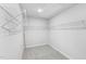 Spacious walk-in closet with neutral walls, carpet, and built-in storage shelves at 2206 Cherry Creek Rd, Haw River, NC 27258