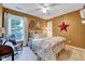 Cozy bedroom with natural light, a star decoration, and comfortable furnishings at 2208 Walden Creek Dr, Apex, NC 27523