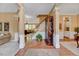 Spacious foyer featuring hardwood floors and an open staircase to the second floor at 2208 Walden Creek Dr, Apex, NC 27523