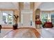Inviting foyer with hardwood floors, large windows, and elegant decor at 2208 Walden Creek Dr, Apex, NC 27523