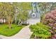 Beautiful two-story home with attached garage and blossoming trees at 2208 Walden Creek Dr, Apex, NC 27523