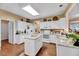 Bright kitchen with white cabinetry, granite countertops, and a center island at 2208 Walden Creek Dr, Apex, NC 27523
