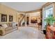 Bright living room with plush carpeting and open access to dining area at 2208 Walden Creek Dr, Apex, NC 27523
