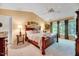 Comfortable bedroom featuring a decorative ceiling fan and a bright, sunlit window at 2208 Walden Creek Dr, Apex, NC 27523