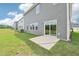 Backyard with a concrete patio and gray vinyl siding at 2210 Cherry Creek Rd, Haw River, NC 27258