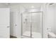 Bathroom boasts tile-surround shower, glass door, and modern fixtures at 2210 Cherry Creek Rd, Haw River, NC 27258