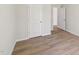 This light and airy bedroom features hard wood floors and fresh white paint at 2210 Cherry Creek Rd, Haw River, NC 27258