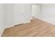 Comfortable bedroom with neutral color palette, featuring a convenient double-door closet for ample storage at 2210 Cherry Creek Rd, Haw River, NC 27258