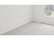 Bright bedroom boasts neutral carpet, light-colored walls, and a window for natural light at 2210 Cherry Creek Rd, Haw River, NC 27258