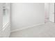 Bright carpeted bedroom with window, white trim and doorways at 2210 Cherry Creek Rd, Haw River, NC 27258