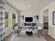 Bright and airy flex space featuring two chairs, a desk and a large window with outdoor views at 2210 Cherry Creek Rd, Haw River, NC 27258