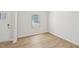 Empty flex space with luxury vinyl flooring and a white door and window at 2210 Cherry Creek Rd, Haw River, NC 27258
