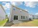 The home's backyard includes a grass lawn, patio, and sliding glass door at 2211 Cherry Creek Rd, Haw River, NC 27258