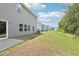 A spacious backyard with a well-manicured lawn offers plenty of room for outdoor activities at 2211 Cherry Creek Rd, Haw River, NC 27258