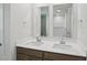 A pristine bathroom features a dual vanity, sleek mirrors, and bright lighting at 2211 Cherry Creek Rd, Haw River, NC 27258