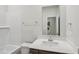 Modern bathroom with a bath tub and a large mirror, and a sink at 2211 Cherry Creek Rd, Haw River, NC 27258