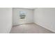 An inviting bedroom has soft carpet, a window with blinds, and is painted in neutral colors at 2211 Cherry Creek Rd, Haw River, NC 27258