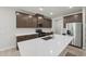 New kitchen features stainless steel appliances, white quartz countertops, and center island at 2211 Cherry Creek Rd, Haw River, NC 27258