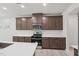 Modern kitchen featuring ample cabinetry, stainless steel appliances, and white countertops at 2211 Cherry Creek Rd, Haw River, NC 27258