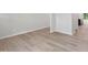 Bright living room with light wood flooring, white walls, and plenty of space at 2211 Cherry Creek Rd, Haw River, NC 27258