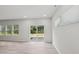 Bright living room with sliding glass doors leading to outdoor space and backyard views at 2211 Cherry Creek Rd, Haw River, NC 27258