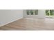 Spacious living area with hardwood floors, large windows, and sliding glass door at 2211 Cherry Creek Rd, Haw River, NC 27258